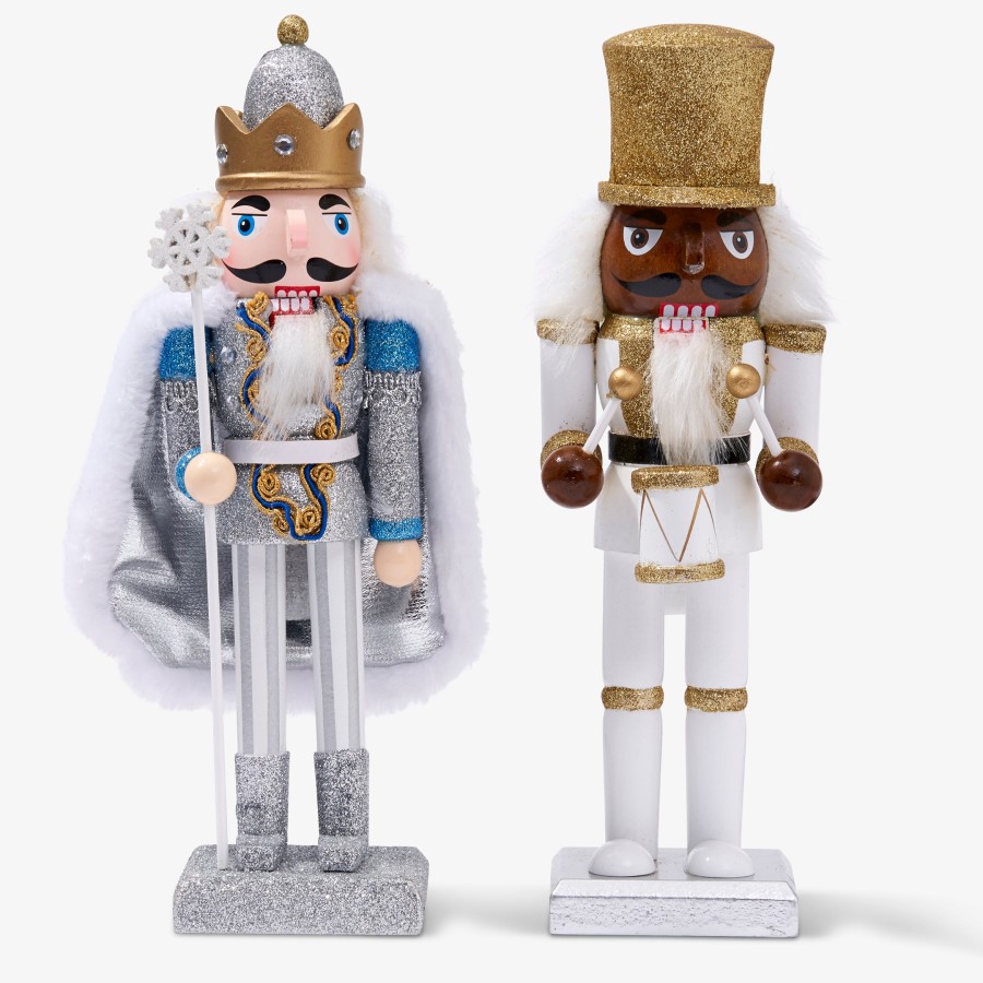 Click to view product details and reviews for 2 White Gold Christmas Nutcrackers.